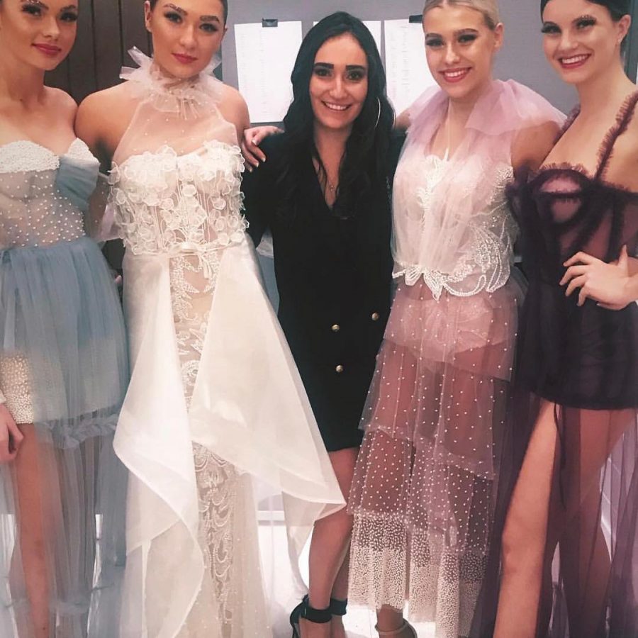 A group of bridal couture models with their designer